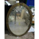 A brass arts and crafts wall mirror: