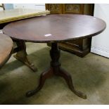 A mahogany pedestal tripod table: