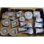 A collection of blue Wedgwood jasper ware: to include vases, lidded boxes, pin dishes, ash tray etc