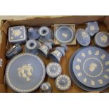 A collection of Wedgwood jasperware: to include plates, lidded boxes, pair of candlesticks,