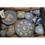 A collection of Wedgwood blue jasper ware: to include plates, a pair of bud vases, cups, lidded