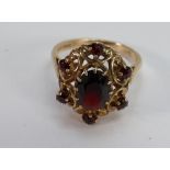 9ct ladies dress ring set with garnets: size O,4.8g.