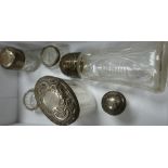 A Collection of Silver & Silver plate topped Glass Bottles