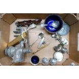 a collection of metalware to include: cruets, grinder,