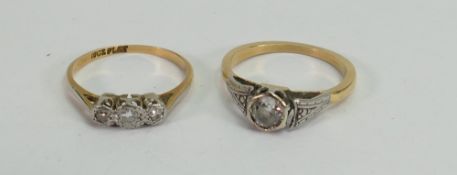 Two diamond rings: A 3 stone and a single stone ring, both set in yellow coloured metal,