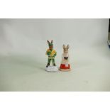 Royal Doulton Bunnykins figures: Ice Hockey Player DB282 and Choir Singer DB223.