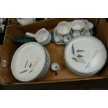 A collection of Denby stone ware green wheat: to include dinner plates,