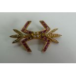 Pretty gem set brooch in gilt metal setting: Measures 47mm wide.