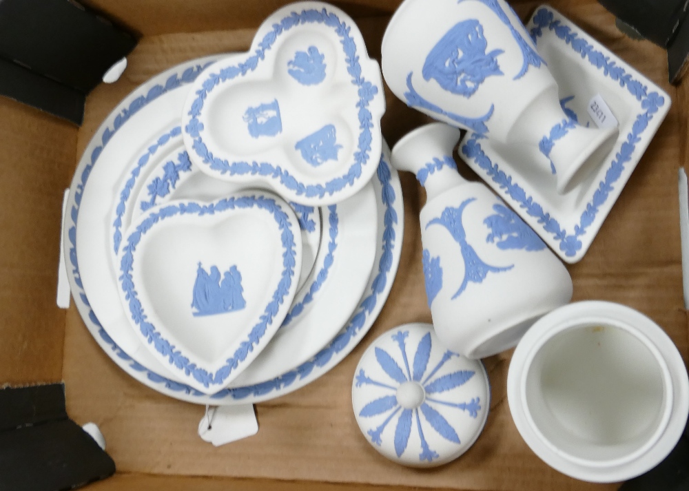 A collection of blue on white Wedgwood jasper ware items to include: plates, ashtrays, lidded pot,