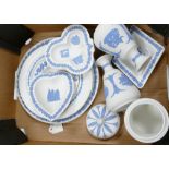 A collection of blue on white Wedgwood jasper ware items to include: plates, ashtrays, lidded pot,