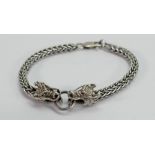 Silver bracelet with dragon heads clasp: 32g.