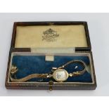 Ladies 14kt gold wristwatch: Maker Fairfax,