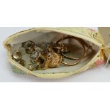 A pouch containing ladies vintage costume jewellery: including frog and owl brooches, earrings,