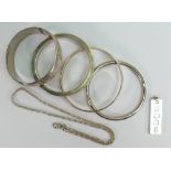 A collection of Silver bangles: including 9ct and silver bangle, 26.