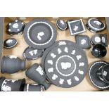 A collection of Wedgwood black basalt jasper ware items to include: plates, vases,