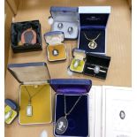A collection of Wedgwood boxed jewellery to include: pendants, tie pins, necklaces,