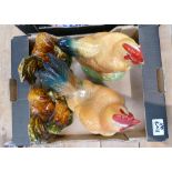 A collection of Majolica style chickens and roosters