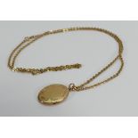 9ct gold necklace and oval pendant: 14.4g.