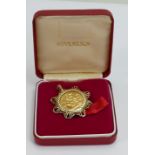 Gold full sovereign dated 1964 in 9ct gold ornate mount: 12.