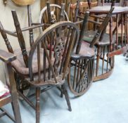 Seven wheel backed pub chairs: