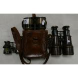 A Collection of Antique Brass & Leather Binoculars: one set cased