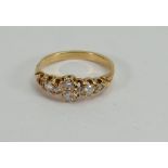 Diamond ring: An 8 stone diamond ring, with one outer diamond missing, set in yellow coloured metal,