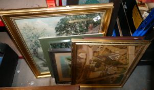 a collection of pictures and prints in ornate frames
