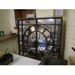 A large wrought iron and mirrored back wall clock: 110cm x 110cm