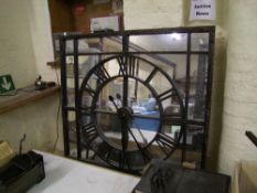 A large wrought iron and mirrored back wall clock: 110cm x 110cm