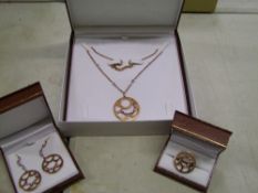 A matching set of leather cased Chavin 18ct rose gold on Sterling Silver: necklace, earrings and