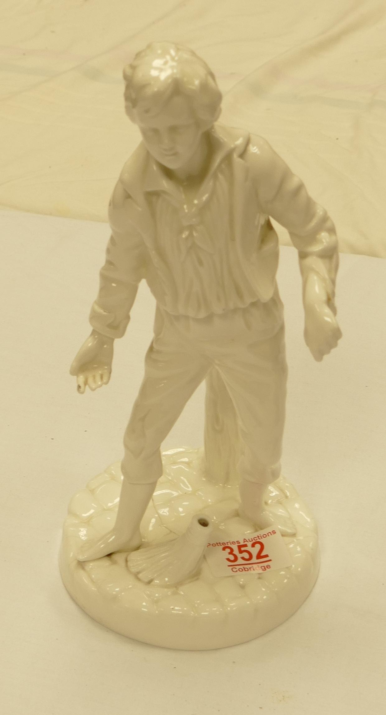 A royal Worcester white ware figure of a boy holding a broom: height 26cm ( broom stick missing