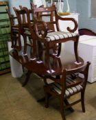 Mahogany effect extending dining table: with four chairs and two carvers. Full length when