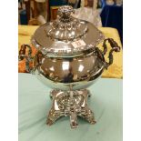 A large silver plated two handled hot water urn: on stand