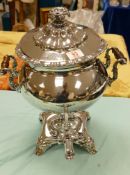 A large silver plated two handled hot water urn: on stand
