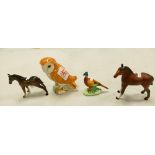 A collection of Beswick items to include: Owl, Foals & Pheasant(4)