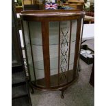 Bow fronted glass display cabinet: