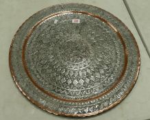 A metal Islamic large round decorated wall plaque: