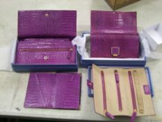 Smythson of London purple leather items: including purse, travel purse, jewellery wallet and