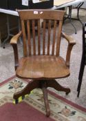 Vintage Oak swivel chair: with cast iron mechanism