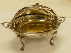 A silver plated revolving tureen on stand: length 43cm