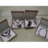 A quantity of Chavin carved horn necklaces: boxed (4).