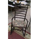 Dark oak laddered back rocking chair: