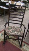 Dark oak laddered back rocking chair: