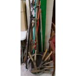 A collection of vintage gardening tools: to include saw, shovels, forks, hand shears etc