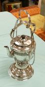 A silver plated kettle on stand: overall height 45cm