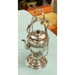 A silver plated kettle on stand: overall height 45cm