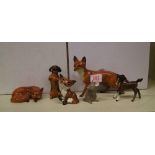 A collection of Beswick items to include: large fox, curled fox ( hairline ), Comical Fox ( hairline