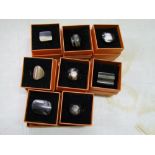 A quantity of Chavin branded carved horn rings: boxed (8).