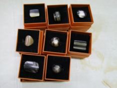 A quantity of Chavin branded carved horn rings: boxed (8).