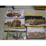 Four boxed Dragon model kits: together with a Tamiya model kit (4).